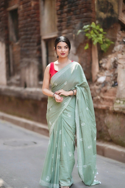 Mint Grace – Elegant Sage Green Soft Silk Saree with Delicate Woven Border