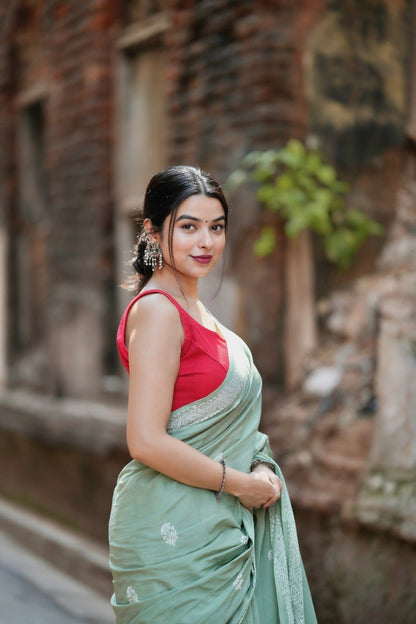 Mint Grace – Elegant Sage Green Soft Silk Saree with Delicate Woven Border