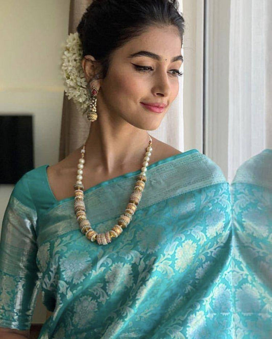 Elegant Teal Blue Silk Saree with Floral Weaving & Traditional Pearl Jewelry Look
